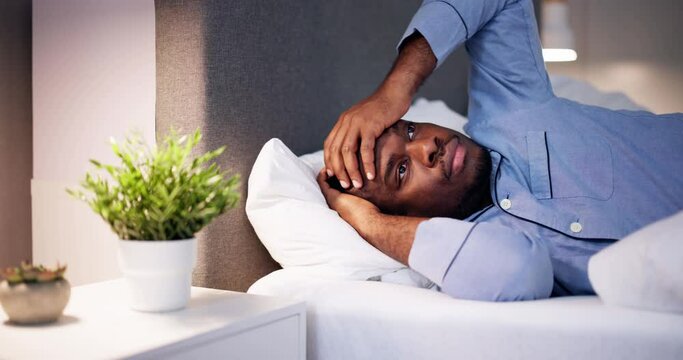 Young African Man Suffering From Fever Lying