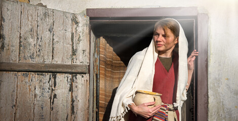 Girl with a pot in ancient clothes