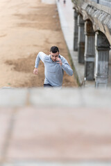 Male runner training on stairs outdoors