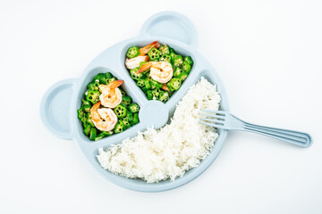 A plate of nutritious meals for kids, fried okra with shrimp and rice