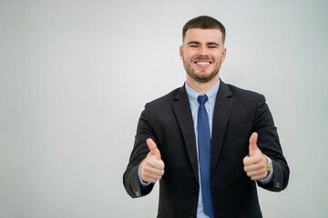 Portrait of a Business Man Showing a Gesture of joy and Success on a White Background