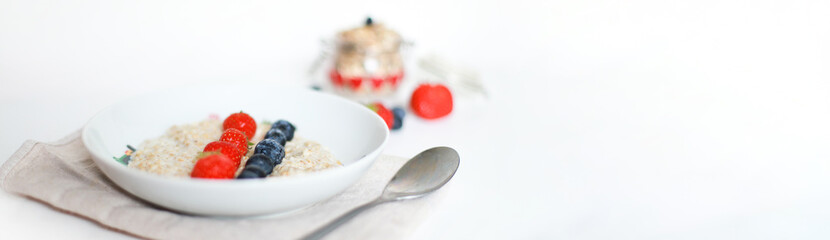 Banner Oatmeal with berries. Breakfast in the hotel. Useful breakfast. Diet, proper nutrition