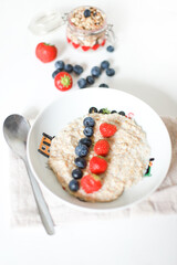 Oatmeal for breakfast for kids. Proper nutrition. Porridge with berries