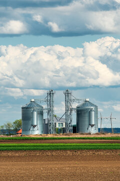 Harvest protection in two large grain silos. Storage and preservation for valuable harvests. Manufactured steel granaries used to store grain on-site.