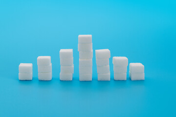 Sugar cubes chart on blue background