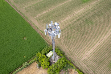 broadcast mobile 4g lte 5g antenna in a rural field in countryside