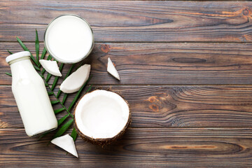 coconut products on white wooden table background. Dairy free milk substitute drink, Flat lay healthy eating