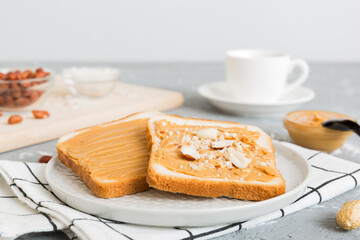 Peanut butter sandwiches or toasts on light table background.Breakfast. Vegetarian food. American cuisine top view vith copy space