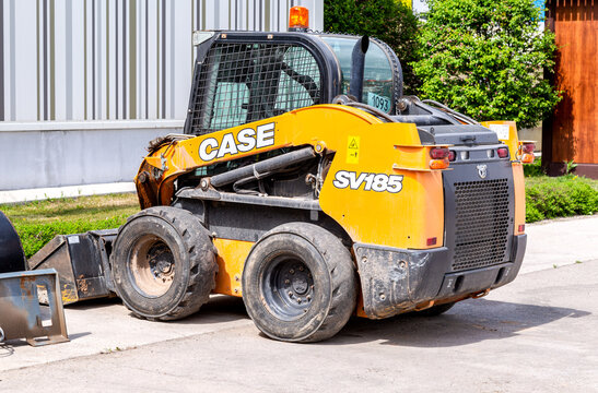 Skid steer loader CASE SV185 at the city street