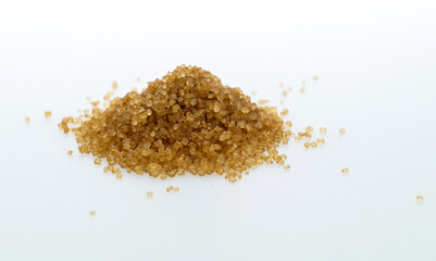 Pile of brown sugar on white background