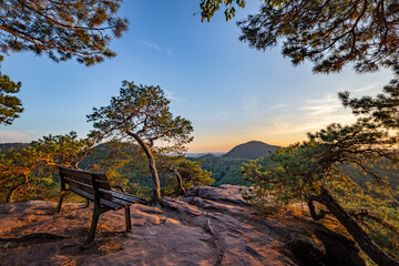 Bench on Rock Slevogtfelsen with View of Palatinate Forest during Sunset, Rhineland-Palatinate, Germany, Europe