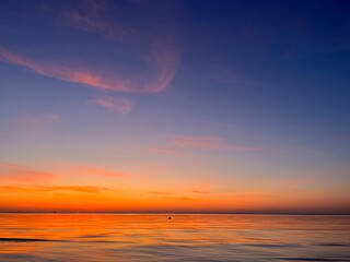 Seascape after the sunset, orange sunset sea horizon, twilights sea view background