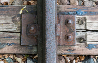 Fototapeta na wymiar Old rusted rail of a railway line