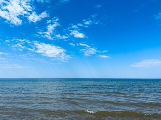 Beautiful blue sea horizon, cloudy sky, cloudy seascape background, daytime 