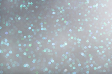 Silver glittering background for design and free space.