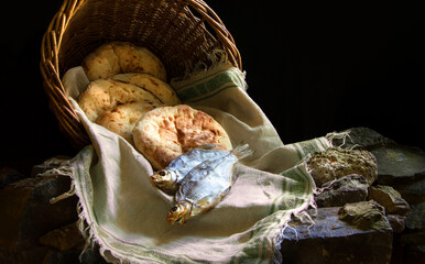 Five loaves and two fish in a basket