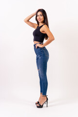 Brunette woman on a white background, casting studio photos, jeans and black t-shirt