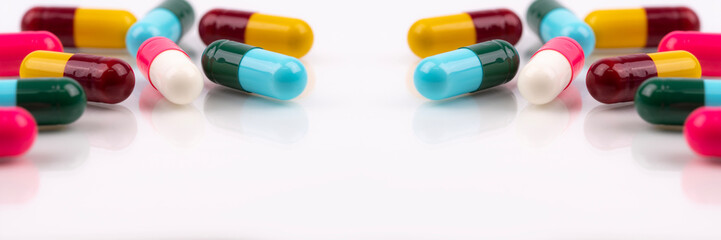 Antibiotic capsule pills on white background. Antibiotic drugs. Healthcare and medicine. Pharmaceutical industry. Prescription drugs. Pharmacology for pharmacists and doctors. Online pharmacy banner.