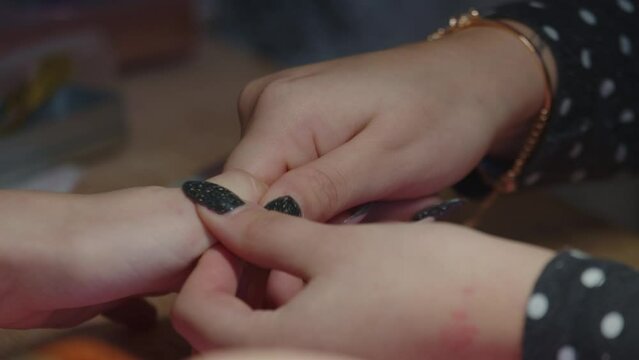 Professional Manicurist Rubbing The Nails. Close Up