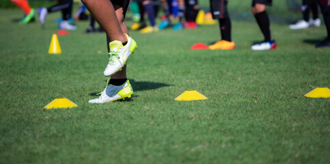 Athlete practicing running football sport on field equipment