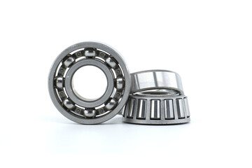 Ball and tapered roller bearing on white background