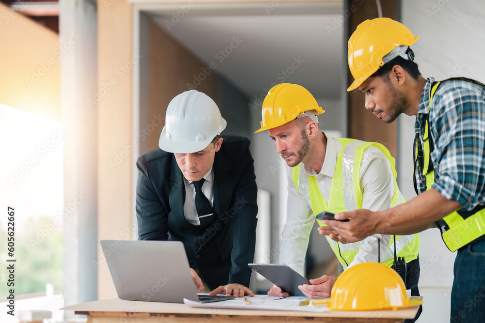 Poster team engineers with draft plan of building on constructing site. engineer work on site. inspector en