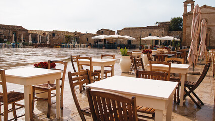 Outdoor restaurant in a typical Italian village. Marzamemi Sicily