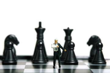 Miniature tiny people toy figure photography. Business preparation concept. A businessman getting...