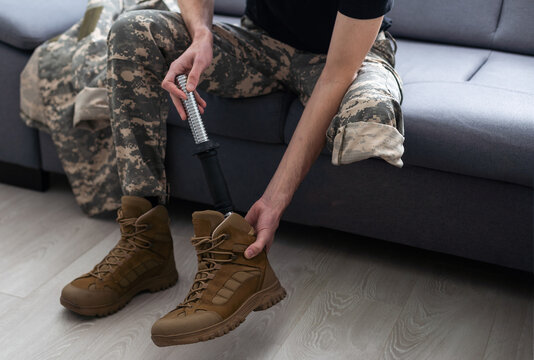 Soldier Artificial Prosthetic leg. War Veteran - Powered by Adobe