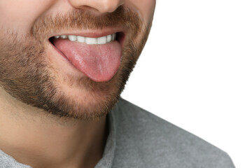 Obraz premium Man showing his tongue on white background, closeup