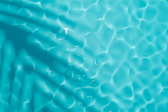 Aqua Waves And Coconut Palm Shadow On Blue Background. Water Pool Texture Top View.Tropical Summer Mockup Design. Luxury Travel Holiday.