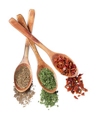 Wooden spoons with different spices on white background, top view