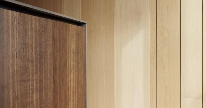 Wooden furniture and wall at home. Pan left view of lumber cabinet located against timber wall in sunlit room, Wooden panels in kitchen room.