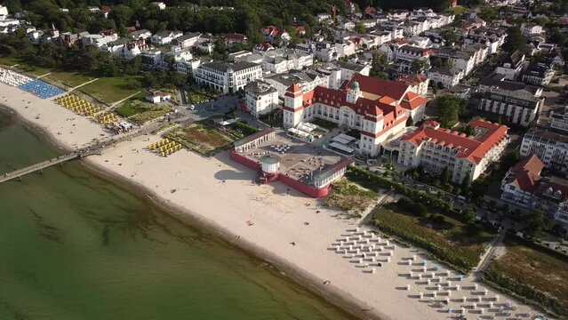 Aerial view, shot by a drone, flight around the seaside resort of Binz with the historic spa house and hotel, located on the Ruegen Island in Germany
