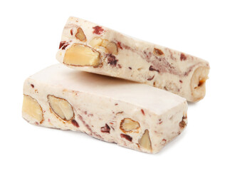 Pieces of delicious nougat on white background