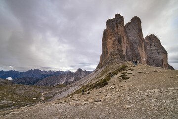 Fototapeta na wymiar Group of tourists hiking in the Dolomites Alps, Italy