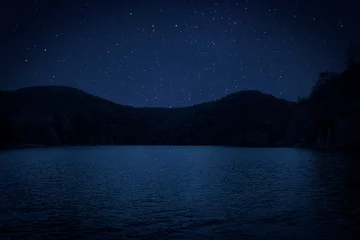 Vlies Fototapete Reflection Amazing starry sky reflecting in lake. Beautiful night landscape