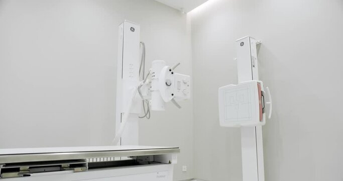 Modern X-ray room, X-Ray Machine. Study of the human body. X-ray machine in lying and standing position. Hospital Radiology Room. Scanning for Fractures, Broken Limbs, Injuries, Cancer or Tumor.