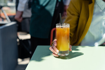 Woman ready to drink Iced bumble Coffee. Summer trendy refreshing coffee drink