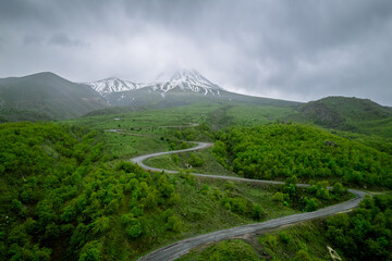 Mount Hasan view during spring, green grass and snowy peaks, stratovolcano in central anatolia