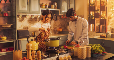 Charming Indian Couple Preparing Food Together: Laughing and Sharing Stories, Creating Delicious Meals, Strengthening Their Bond in a Cozy Kitchen. 