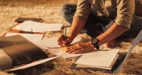 Close Up on Hands of a Male Studying at Home: Engaged in Learning, Researching, and Project Management. Productive Young Entrepreneur Uses Computer and Sticky Notes for Brainstorming