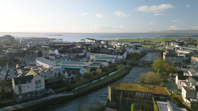 Cinematic Aerial View of Galway City, Ireland. River Corrib. Beautiful Day. Galway Bay in Background