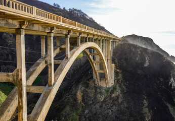 Rocky Creek bridge in an arch form connecting two side of a mountain in California