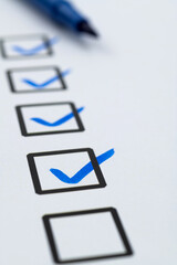 Blue pen marking on checklist sheet