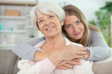 happy loving older mature mother and grown daughter embracing