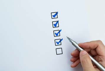 Blue pen marking on checklist sheet