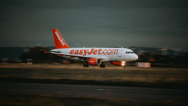 EasyJet airplane a320 taking off at sunset in John Lennon Airport, Liverpool, United Kingdom