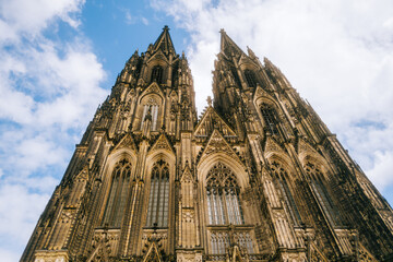Fototapeta premium Cologne Cathedral with blue sky. Cologne Cathedral, or Kolner Dom, is the main landmark of Cologne and a catholic church in Germany.