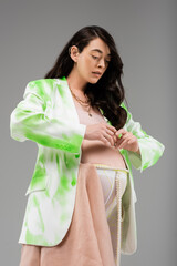expecting mother in green and white jacket, crop top, leggings with beads belt and chiffon cloth...